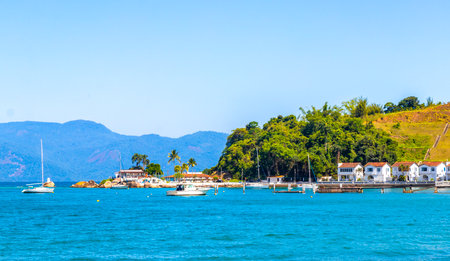 Angra dos Reis State of Rio de Janeiro Brazil October 28, 2020 Panorama of tropical coast beach seascape with turquoise green blue water pier port harbor with ships yachts and boats.の写真素材