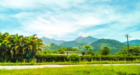 Tropical mountain mountains hill hills with jungle forest trees plants clouds and blue sky in Angra dos Reis State of Rio de Janeiro Brazil.の写真素材