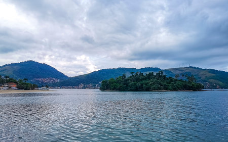 Panorama of tropical islands nature coast beach with turquoise green and clear water rocks boulders and blue sky in Angra dos Reis State of Rio de Janeiro Brazil.の写真素材