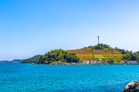 Angra dos Reis State of Rio de Janeiro Brazil October 28, 2020 Panorama of tropical islands island coast beach seascape with turquoise green blue water mountains and pier port with boats.の写真素材