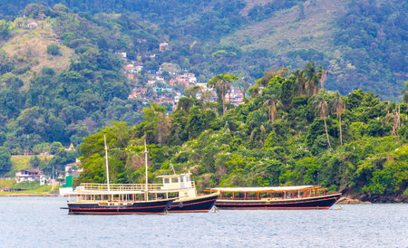Angra dos Reis State of Rio de Janeiro Brazil October 26, 2020 Panorama of tropical coast beach seascape with turquoise green blue water pier port harbor with ships yachts and boats in Brazil.の写真素材