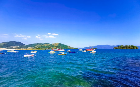 Angra dos Reis State of Rio de Janeiro Brazil October 28, 2020 Panorama of tropical coast beach seascape with turquoise green blue water pier port harbor with ships yachts and boats.の写真素材