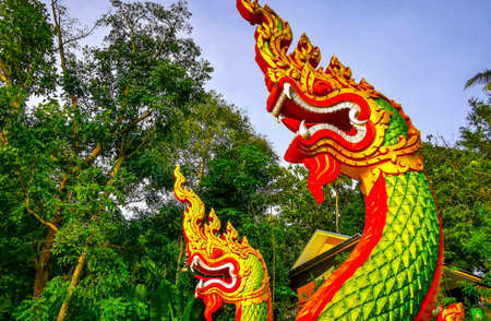 Kathu District Phuket Island Province Thailand October 26, 2025 Suwankeereewong Temple colorful green golden naga dragon snake sculpture sculptures statue statues in Patong Beach Phuket Thailand.の写真素材