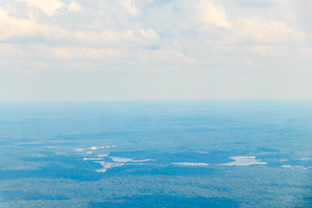 Flight in plane with aerial panorama view to Amazon river Rio negro tropical jungle rainforest of State of Amazonas Brazil.の写真素材