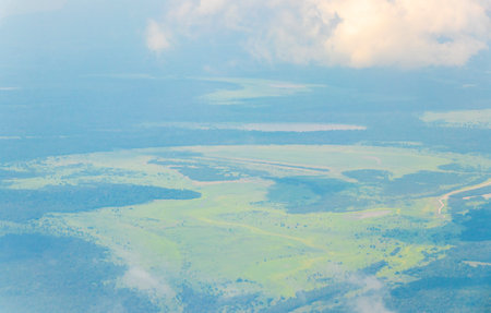 Flight in plane with aerial panorama view to Amazon river Rio negro tropical jungle rainforest of State of Amazonas Brazil.の写真素材