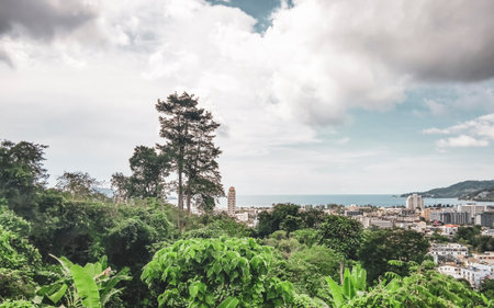 Panoramic view and panorama of tropical landscape mountains city and beach with blue sky in Patong Beach Kathu District Phuket Island Province Southern Thailand in Southeast Asia.の写真素材