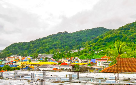 Panoramic view and panorama of tropical landscape mountains city skyline cityscape jungle forest and nature with blue sky in Patong Beach Kathu Phuket Island Province Thailand in Southeast Asia.の写真素材