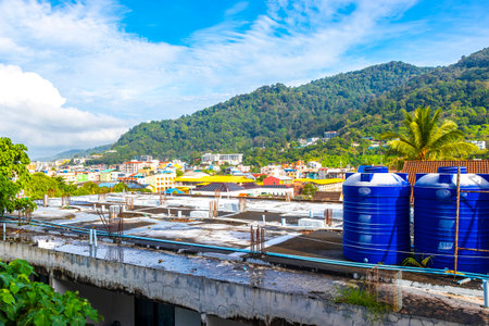 Panoramic view and panorama of tropical landscape mountains city skyline cityscape jungle forest and nature with blue sky in Phuket Island Province Thailand in Southeast Asia.の写真素材