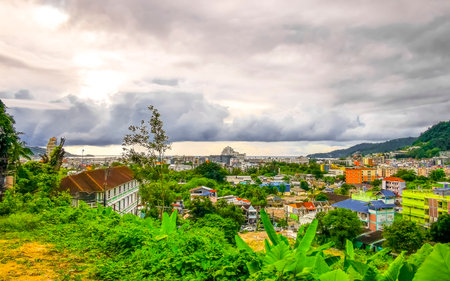 Panoramic view and panorama of tropical landscape mountains city and beach with blue sky in Patong Beach Kathu District Phuket Island Province Southern Thailand in Southeast Asia.の写真素材