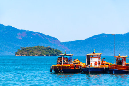 Angra dos Reis State of Rio de Janeiro Brazil October 28, 2020 Panorama of tropical coast beach seascape with turquoise green blue water pier port harbor with ships yachts and boats in Brazil.の写真素材
