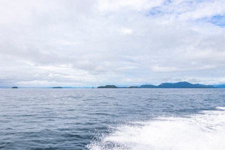 Panorama of tropical islands nature coast beach with turquoise green and clear water rocks boulders and blue sky.の写真素材