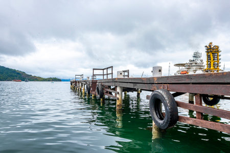 Angra dos Reis State of Rio de Janeiro Brazil November 19, 2020 Panorama of tropical coast beach seascape with pier port harbor with tourists people ships yachts and boats.の写真素材