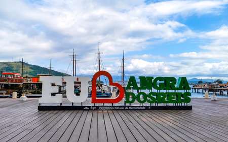 Angra dos Reis State of Rio de Janeiro Brazil October 27, 2020 I love Angra dos Reis sign lettering signage letters at the pier with turquoise water green mountains and blue sky in State of Rio de Janeiro Brazil.のeditorial素材