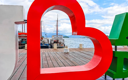 Angra dos Reis State of Rio de Janeiro Brazil October 27, 2020 I love Angra dos Reis sign lettering signage letters at the pier with turquoise water green mountains and blue sky in State of Rio de Janeiro Brazil.のeditorial素材