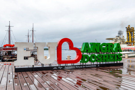 Angra dos Reis State of Rio de Janeiro Brazil November 19, 2020 I love Angra dos Reis sign lettering signage letters at the pier with turquoise water green mountains and blue sky in State of Rio de Janeiro Brazil.のeditorial素材