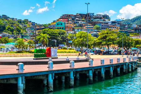 Angra dos Reis State of Rio de Janeiro Brazil October 26, 2020 I love Angra dos Reis sign lettering signage letters at the pier with turquoise water green mountains and blue sky in State of Rio de Janeiro Brazil.のeditorial素材