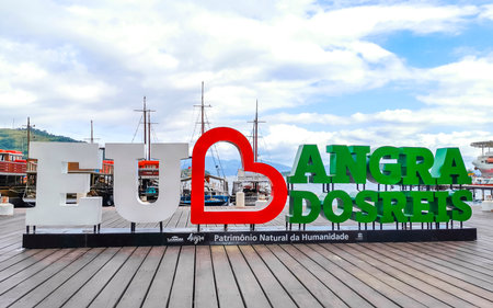 Angra dos Reis State of Rio de Janeiro Brazil October 27, 2020 I love Angra dos Reis sign lettering signage letters at the pier with turquoise water green mountains and blue sky in State of Rio de Janeiro Brazil.のeditorial素材
