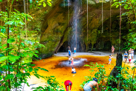 Presidente Figueiredo State of Amazonas Brazil December 20, 2020 Cave rainforest with waterfall limestone rocks trail people and interior of Gruta Palacio do Galo da Serra Gruta da Onca.のeditorial素材