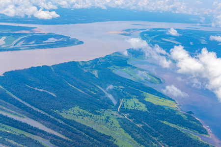 Flight in plane with aerial panorama view to Amazon river Rio negro tropical jungle rainforest of State of Amazonas Brazil.の写真素材