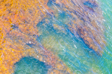 Foz do Iguacu Iguazu Falls waterfall in tropical nature rainforest panorama view with blue sky and turquoise green water in Parana Brazil and Misiones Argentina.の写真素材