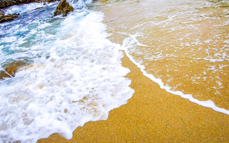 Rocky Kalim Beach tropical landscape panorama view with turquoise blue clear water waves and rocks in Patong Beach Kathu District Phuket Island Province Southern Thailand in Southeast Asia.の写真素材