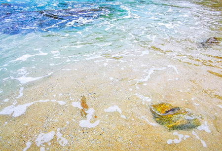 Rocky Kalim Beach tropical landscape panorama view with turquoise blue clear water waves and rocks in Patong Beach Kathu District Phuket Island Province Southern Thailand in Southeast Asia.の写真素材