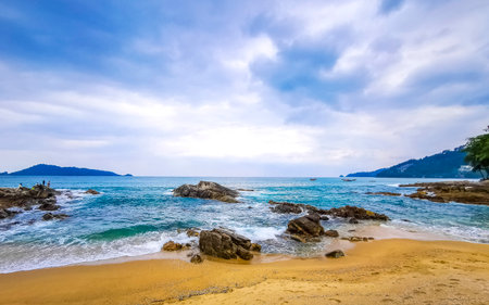 Amazing rocky tropical landscape panorama view with blue sky turquoise water waves and rocks in Phuket Province Southern Thailand in Southeast Asia.の写真素材