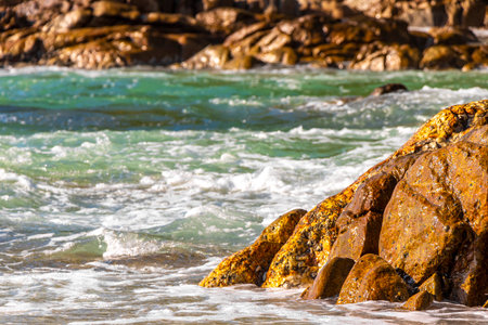 Rocky Kalim Beach tropical landscape panorama view with turquoise blue clear water waves sand and rocks in Patong Beach Kathu District Phuket Island Province Southern Thailand in Southeast Asia.の写真素材
