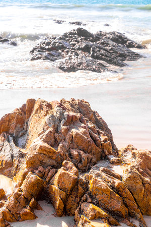 Rocky Kalim Beach tropical landscape panorama view with turquoise blue clear water waves sand and rocks in Patong Beach Kathu District Phuket Island Province Southern Thailand in Southeast Asia.の写真素材