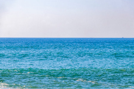 Rocky Kalim Beach tropical landscape panorama view with turquoise blue clear water waves and splash in Patong Beach Kathu District Phuket Island Province Southern Thailand in Southeast Asia.の写真素材