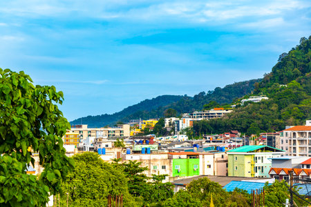 Panoramic view and panorama of tropical landscape mountains city skyline cityscape jungle forest and nature with blue sky in Patong Beach Kathu Phuket Island Province Thailand in Southeast Asia.の写真素材
