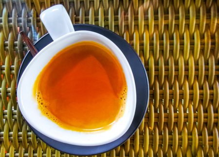 Glass cup of americano black coffee with spoon and plate on table food and drink in the restaurant...