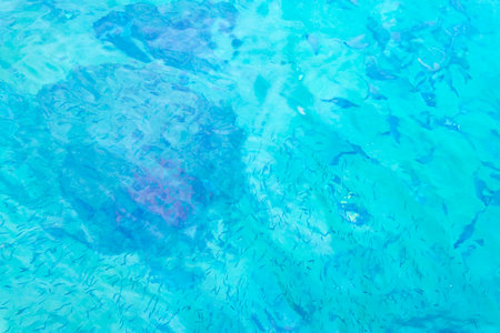 Beach shore coast water and wave waves texture pattern blue turquoise green water and white yellow sand on Ilha Grande Big Island Angra dos Reis State of Rio de Janeiro Brazil.の写真素材