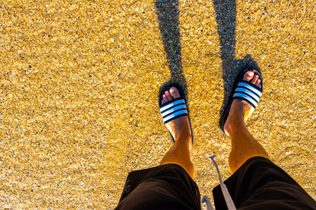 Kathu District Phuket Island Province Thailand November 29, 2025 flip flops slippers on the beach...