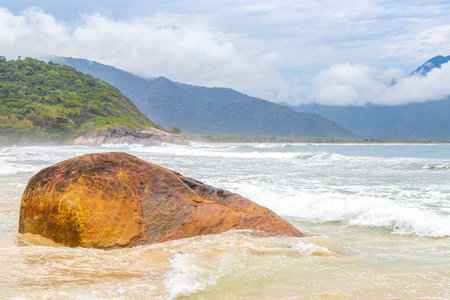 Aventureiro Beach tropical landscape panorama view with turquoise water waves palm trees and rocks on Ilha Grande Big Island Angra dos Reis State of Rio de Janeiro Brazil.の写真素材