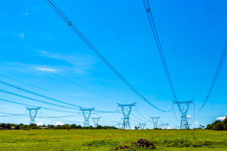 Brazil's largest dam in the world Itaipu for energy production on the border with Paraguay electricity pylons water river and power pole in Foz do Iguacu State of Parana Brazil.の写真素材