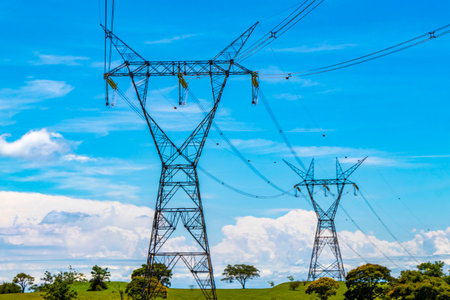 Largest dam in the world for energy production on the border with Paraguay electricity pylons water...