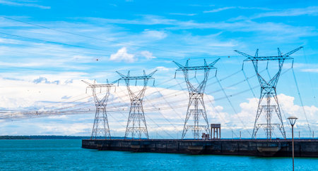 Brazil's largest dam in the world Itaipu for energy production on the border with Paraguay electricity pylons water river and power pole in Foz do Iguacu State of Parana Brazil.の写真素材