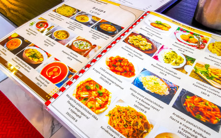 Kathu District Phuket Island Thailand December 16, 2025 Menu with Russian and Indian dishes in the restaurant Parivar in Patong Beach Phuket Island Province Southern Thailand.のeditorial素材