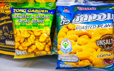 Kathu District Phuket Island Thailand October 07, 2025 Inside 7 Eleven store shop supermarket with aisles and shelves full of Asian snack nuts broad beans seeds products in Patong Beach Thailand.のeditorial素材