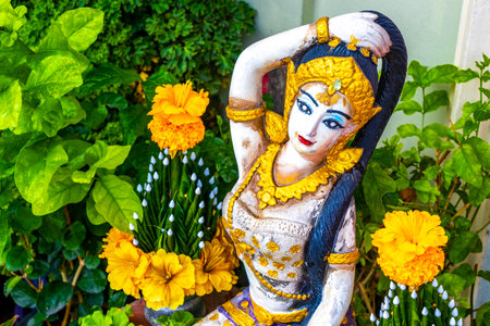 Buddhist mother goddess figure sculpture statue in a tropical zen garden in Patong Beach Kathu District Phuket Island Province Southern Thailand in Southeast Asia.の写真素材