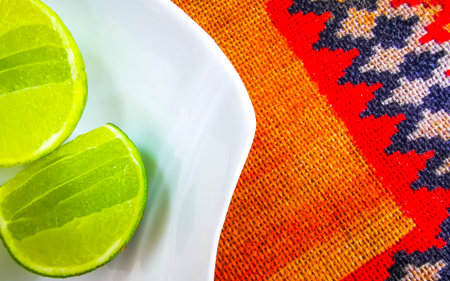 Halved lime served a white plate in Patong Beach Kathu District Phuket Island Province Southern...