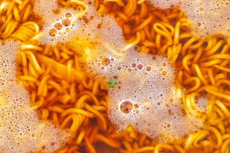 Asian Thai instant noodle soup in a bowl spicy with egg and spoon.の写真素材