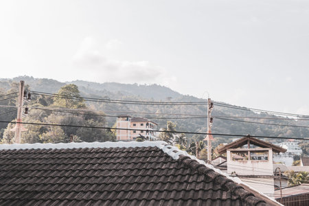 Panoramic view and panorama of tropical landscape mountains hills city jungle rainforest and nature with buildings houses and blue sky in Patong Beach Kathu Phuket Island Thailand.の写真素材