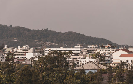 Panoramic view and panorama of tropical landscape mountains city skyline cityscape jungle forest and nature with blue sky in Phuket Island Province Thailand in Southeast Asia.の写真素材
