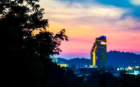 Panoramic view night sunset panorama of tropical landscape mountains hills city skyline cityscape lights jungle rainforest seascape and beach and nature in Patong Beach Kathu Phuket Island Thailand.の写真素材