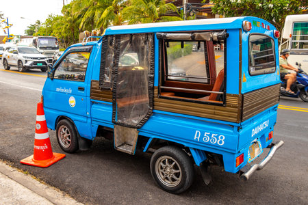 Kathu District Phuket Island Province Thailand February 11, 2026 Blue public transportation tuk tuk...