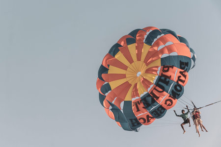Kathu District Phuket Island Province Thailand 05. March 2026 Patong Beach panorama view of people tourism on parasailing parachute sport activity with blue sky and clouds in Patong Phuket Thailand.のeditorial素材