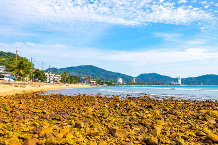 Kathu District Phuket Island Province Thailand 10. March 2026 Kalim Beach bay tropical landscape panorama view with turquoise water waves palm trees boulders and rock rocks in Patong Beach Thailand.のeditorial素材