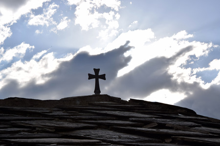 Christian cross on roof temple with sky and cloud background. Macedonia.の写真素材
